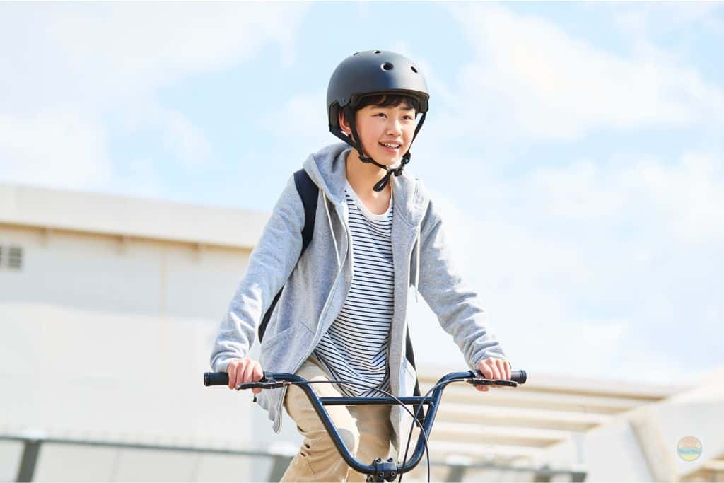 Boy on a bike with a helmet